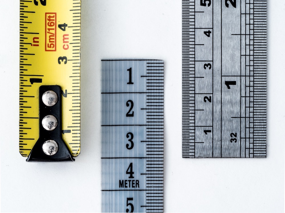 Measurement tapes of different units.